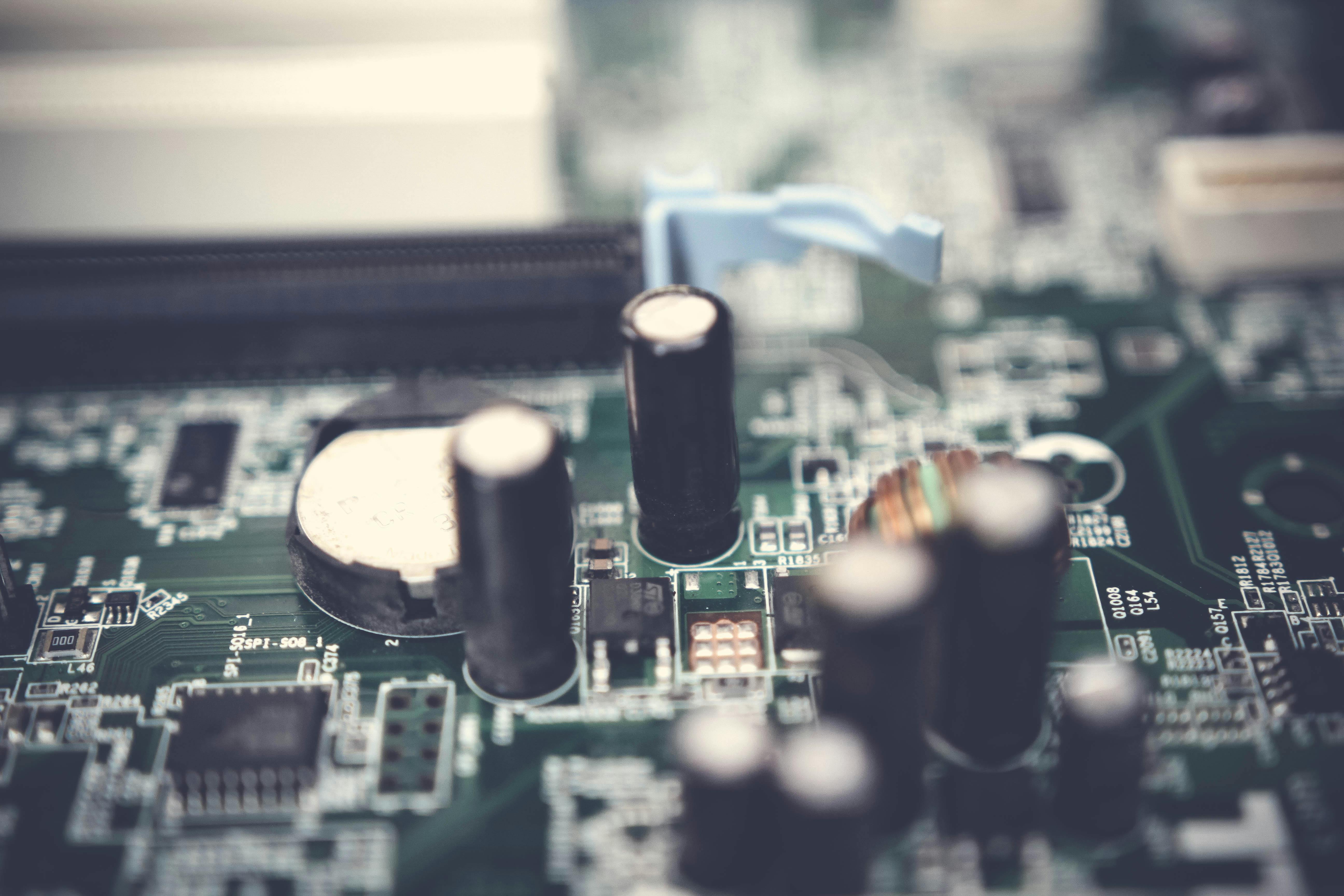 Selective Focus Photo of Electrolytic Capacitors on Circuit Board · Free  Stock Photo